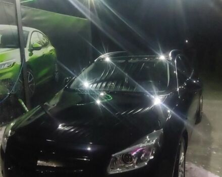 Черный Опель Инсигния, объемом двигателя 2 л и пробегом 328 тыс. км за 3200 $, фото 1 на Automoto.ua