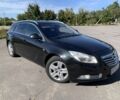 Чорний Опель Інсігнія, об'ємом двигуна 2 л та пробігом 219 тис. км за 6524 $, фото 1 на Automoto.ua