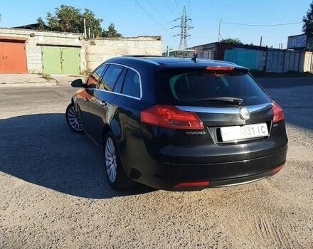 Чорний Опель Інсігнія, об'ємом двигуна 2 л та пробігом 180 тис. км за 8400 $, фото 1 на Automoto.ua