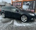 Чорний Опель Інсігнія, об'ємом двигуна 2 л та пробігом 295 тис. км за 7999 $, фото 1 на Automoto.ua