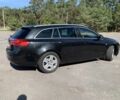 Чорний Опель Інсігнія, об'ємом двигуна 2 л та пробігом 219 тис. км за 6524 $, фото 2 на Automoto.ua