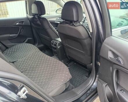 Чорний Опель Інсігнія, об'ємом двигуна 1.96 л та пробігом 179 тис. км за 6399 $, фото 14 на Automoto.ua