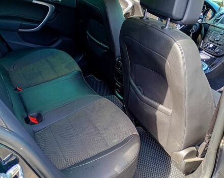 Черный Опель Инсигния, объемом двигателя 2 л и пробегом 322 тыс. км за 7500 $, фото 1 на Automoto.ua