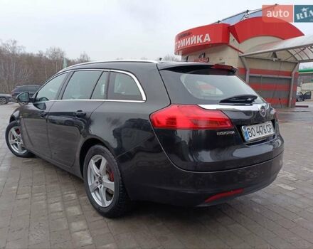 Чорний Опель Інсігнія, об'ємом двигуна 1.96 л та пробігом 179 тис. км за 6399 $, фото 4 на Automoto.ua