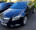 Чорний Опель Інсігнія, об'ємом двигуна 2 л та пробігом 325 тис. км за 5899 $, фото 1 на Automoto.ua