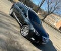 Чорний Опель Інсігнія, об'ємом двигуна 2 л та пробігом 340 тис. км за 7293 $, фото 1 на Automoto.ua