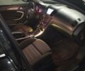 Черный Опель Инсигния, объемом двигателя 2 л и пробегом 265 тыс. км за 10500 $, фото 1 на Automoto.ua