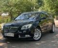 Чорний Опель Інсігнія, об'ємом двигуна 2 л та пробігом 225 тис. км за 6765 $, фото 1 на Automoto.ua