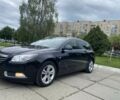Черный Опель Инсигния, объемом двигателя 2 л и пробегом 303 тыс. км за 7700 $, фото 1 на Automoto.ua