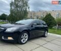 Чорний Опель Інсігнія, об'ємом двигуна 2 л та пробігом 303 тис. км за 7500 $, фото 1 на Automoto.ua