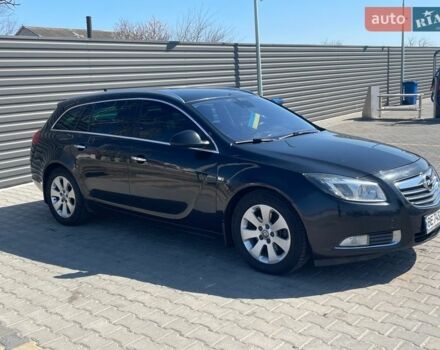 Чорний Опель Інсігнія, об'ємом двигуна 1.96 л та пробігом 250 тис. км за 8999 $, фото 2 на Automoto.ua