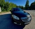 Чорний Опель Інсігнія, об'ємом двигуна 2 л та пробігом 257 тис. км за 8500 $, фото 1 на Automoto.ua