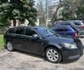 Чорний Опель Інсігнія, об'ємом двигуна 2 л та пробігом 243 тис. км за 7513 $, фото 1 на Automoto.ua