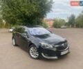 Чорний Опель Інсігнія, об'ємом двигуна 2 л та пробігом 173 тис. км за 13999 $, фото 1 на Automoto.ua