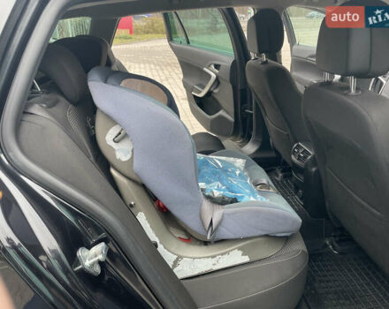 Черный Опель Инсигния, объемом двигателя 2 л и пробегом 180 тыс. км за 9400 $, фото 78 на Automoto.ua