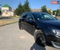 Чорний Опель Інсігнія, об'ємом двигуна 1.96 л та пробігом 264 тис. км за 8750 $, фото 1 на Automoto.ua