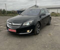 Чорний Опель Інсігнія, об'ємом двигуна 2 л та пробігом 233 тис. км за 12888 $, фото 1 на Automoto.ua