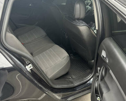 Черный Опель Инсигния, объемом двигателя 1.96 л и пробегом 285 тыс. км за 9800 $, фото 6 на Automoto.ua