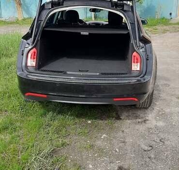 Чорний Опель Інсігнія, об'ємом двигуна 2 л та пробігом 240 тис. км за 10100 $, фото 4 на Automoto.ua