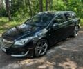 Чорний Опель Інсігнія, об'ємом двигуна 2 л та пробігом 285 тис. км за 13111 $, фото 1 на Automoto.ua