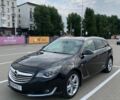 Черный Опель Инсигния, объемом двигателя 2 л и пробегом 349 тыс. км за 9300 $, фото 1 на Automoto.ua