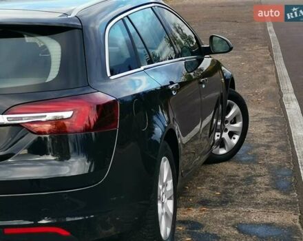 Чорний Опель Інсігнія, об'ємом двигуна 1.96 л та пробігом 205 тис. км за 12999 $, фото 6 на Automoto.ua