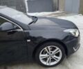 Черный Опель Инсигния, объемом двигателя 2 л и пробегом 323 тыс. км за 11500 $, фото 1 на Automoto.ua