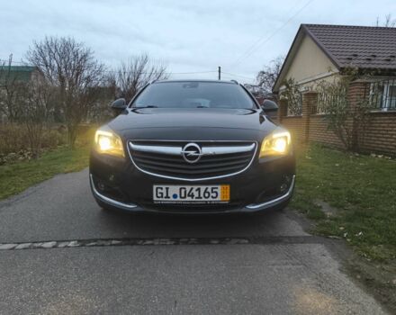 Чорний Опель Інсігнія, об'ємом двигуна 2 л та пробігом 255 тис. км за 10999 $, фото 2 на Automoto.ua