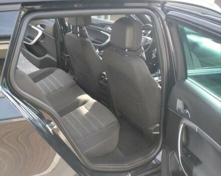 Чорний Опель Інсігнія, об'ємом двигуна 1.6 л та пробігом 225 тис. км за 12200 $, фото 1 на Automoto.ua