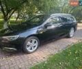Чорний Опель Інсігнія, об'ємом двигуна 2 л та пробігом 180 тис. км за 15200 $, фото 1 на Automoto.ua