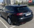 Чорний Опель Інсігнія, об'ємом двигуна 2 л та пробігом 213 тис. км за 11900 $, фото 1 на Automoto.ua