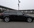 Чорний Опель Інсігнія, об'ємом двигуна 2 л та пробігом 234 тис. км за 12940 $, фото 5 на Automoto.ua