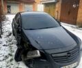 Черный Опель Инсигния, объемом двигателя 2 л и пробегом 248 тыс. км за 4800 $, фото 1 на Automoto.ua