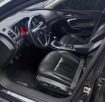 Чорний Опель Інсігнія, об'ємом двигуна 1.96 л та пробігом 175 тис. км за 9950 $, фото 7 на Automoto.ua