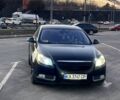 Черный Опель Инсигния, объемом двигателя 2 л и пробегом 300 тыс. км за 8600 $, фото 1 на Automoto.ua