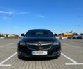 Чорний Опель Інсігнія, об'ємом двигуна 1.96 л та пробігом 256 тис. км за 12900 $, фото 1 на Automoto.ua