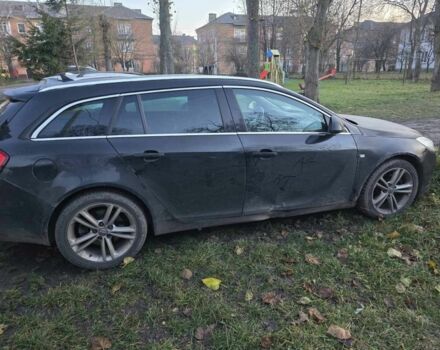 Черный Опель Инсигния, объемом двигателя 2 л и пробегом 305 тыс. км за 2800 $, фото 1 на Automoto.ua