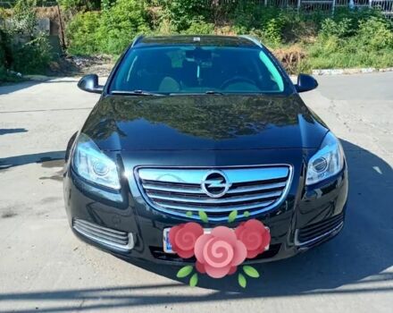 Черный Опель Инсигния, объемом двигателя 2 л и пробегом 323 тыс. км за 6915 $, фото 1 на Automoto.ua