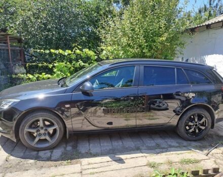 Чорний Опель Інсігнія, об'ємом двигуна 2 л та пробігом 350 тис. км за 7493 $, фото 1 на Automoto.ua