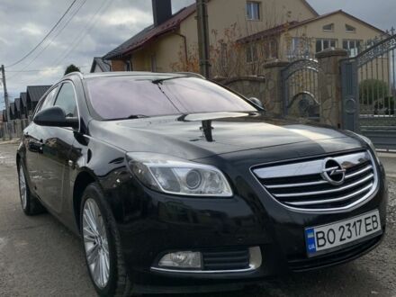 Чорний Опель Інсігнія, об'ємом двигуна 2 л та пробігом 280 тис. км за 10500 $, фото 1 на Automoto.ua