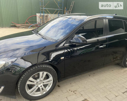 Черный Опель Инсигния, объемом двигателя 2 л и пробегом 235 тыс. км за 10900 $, фото 1 на Automoto.ua