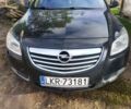 Красный Опель Инсигния, объемом двигателя 2 л и пробегом 312 тыс. км за 3700 $, фото 1 на Automoto.ua
