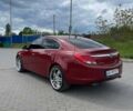 Красный Опель Инсигния, объемом двигателя 2 л и пробегом 240 тыс. км за 8300 $, фото 5 на Automoto.ua