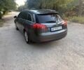 Серый Опель Инсигния, объемом двигателя 1.8 л и пробегом 150 тыс. км за 6432 $, фото 2 на Automoto.ua