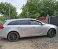Серый Опель Инсигния, объемом двигателя 2 л и пробегом 240 тыс. км за 7000 $, фото 1 на Automoto.ua