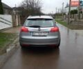 Серый Опель Инсигния, объемом двигателя 2 л и пробегом 220 тыс. км за 8300 $, фото 6 на Automoto.ua