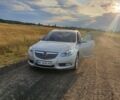 Серый Опель Инсигния, объемом двигателя 2 л и пробегом 196 тыс. км за 9500 $, фото 3 на Automoto.ua