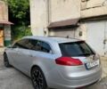 Серый Опель Инсигния, объемом двигателя 2 л и пробегом 326 тыс. км за 7000 $, фото 1 на Automoto.ua