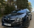 Серый Опель Инсигния, объемом двигателя 2 л и пробегом 205 тыс. км за 13500 $, фото 4 на Automoto.ua