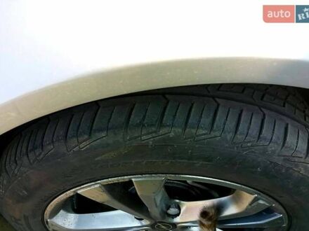 Серый Опель Инсигния, объемом двигателя 2 л и пробегом 999 тыс. км за 7500 $, фото 1 на Automoto.ua